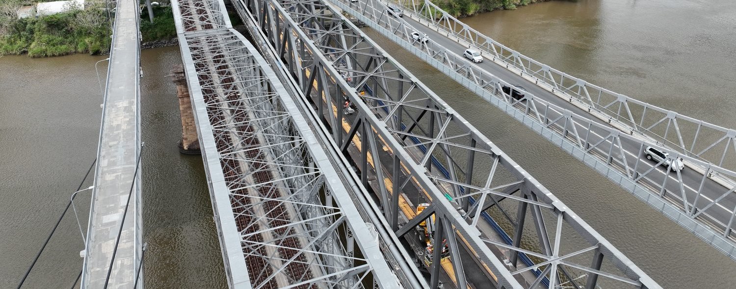 Aerial view along the Indooroopilly rail bridge trusses over the Brisbane River