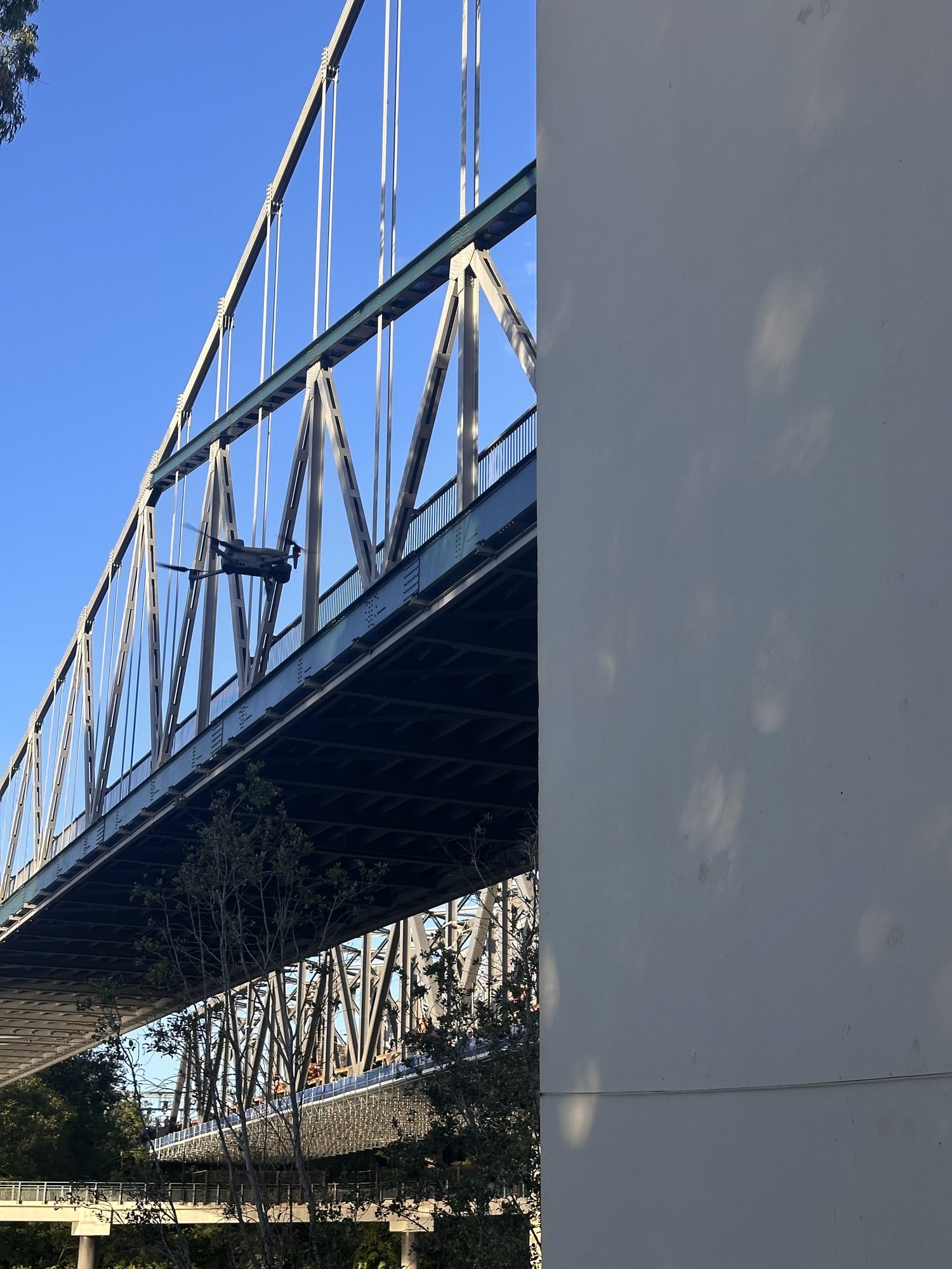 The Matrice 4 Enterprise RTK platform holding position at the Indooroopilly rail bridge