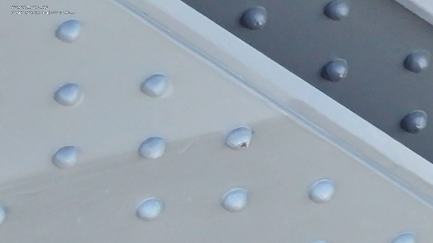 Corrosion detail on rail bridge steelwork captured during close visual drone inspection
