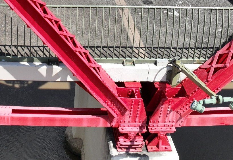 Drone photograph of a riveted steel truss node on a rail bridge inspection
