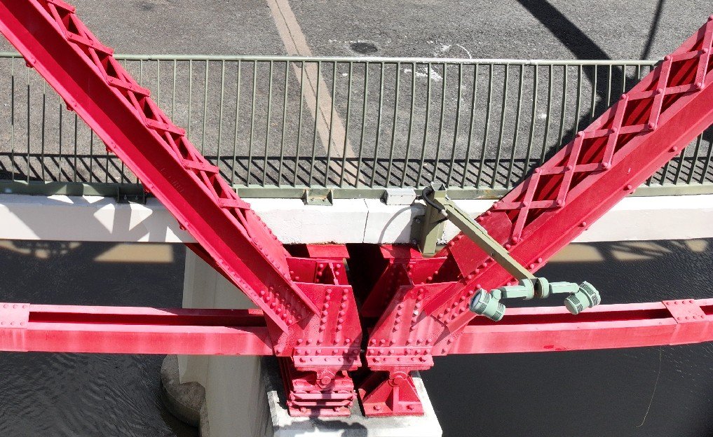 Drone photograph of a riveted truss node on a rail bridge inspection